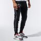 Férfi nadrágok NEW ERA NADRÁG NBA STRIPE PIPING JOGGER CHIBUL BLK 11860095 