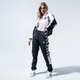 Női nadrágok PUMA NADRÁG TFS OG AOP PANTS 59706001 szín: fekete