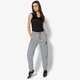 Női nadrágok NIKE NADRÁG W NSW RALLY PANT REG 894850-091 szín: szürke