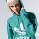 Női pulóver ADIDAS PULÓVER KAPUCNIS TRF HOODIE fm3297 szín: zöld