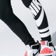 Gyerek nadrágok NIKE LEGGINGS SPORTSWEAR 939447-010 szín: fekete
